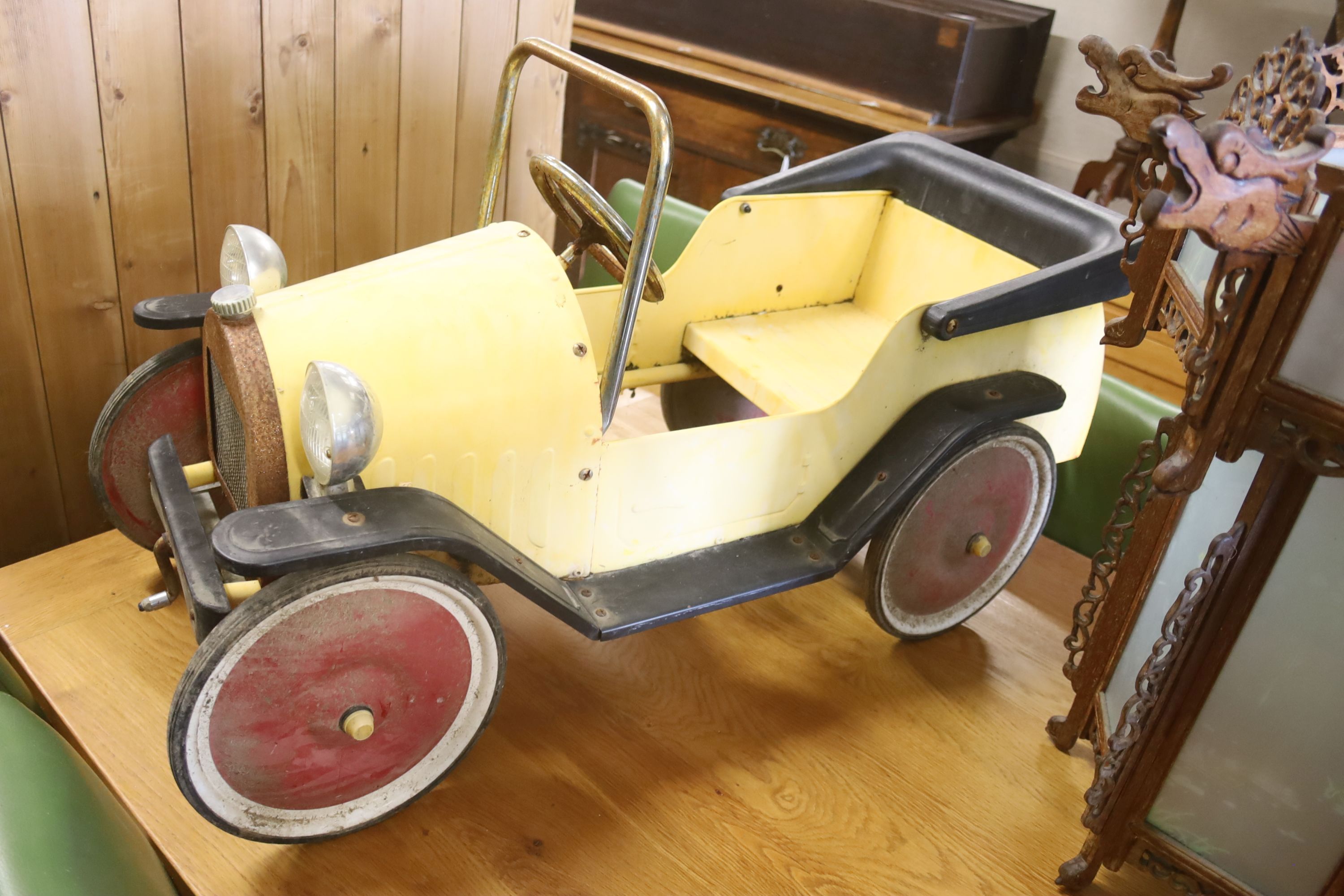 A child's tinplate pedal car, length 94cm